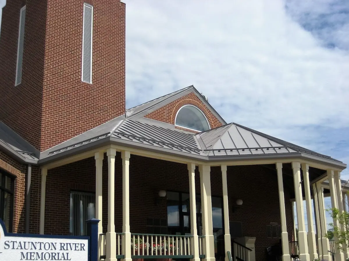 Skilled roofing craftsmen working on a residential roof in Kochville